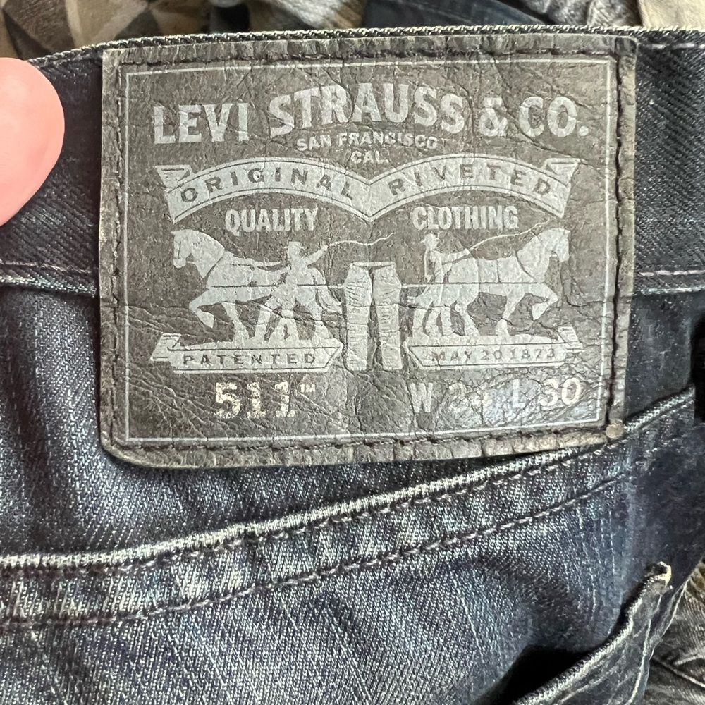 Battered black levis 511 jeans
